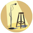 Microphone, spotlight, empty stool